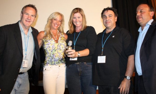 Cameron Barrett (center) holding her award for "Continuum: Against All Odds" winner of the Best Short Documentary at the 2009 All Sports Los Angeles Film Festival
