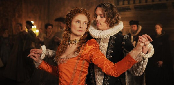 Festive costumes are worn by Joely Richardson and Jamie Campbell Bower in this scene from Anonymous