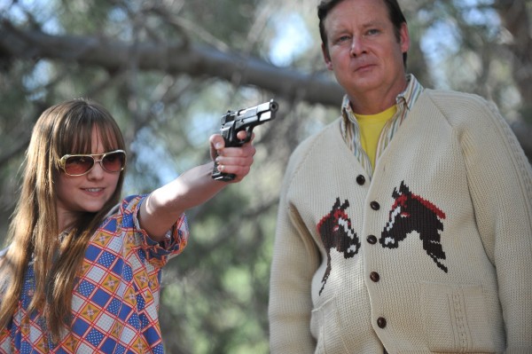 Frank (Joel Murray) teaches Roxy (Tara Lynne Barr) how to shoot.