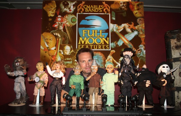 Jon Donahue poses with some of the puppets from the Puppet Master movie series