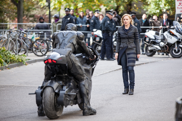 Robocop on his cycle with his wife Clara (Abbie Cornish)