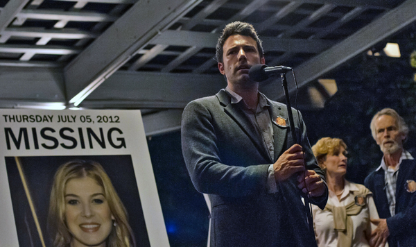 Nick (Ben Affleck) gives a speech at a rally for his missing wife Amy