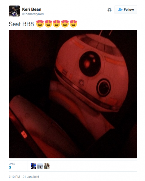 A fan is elated to find the BB-8 seat during her movie going experience